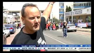 Right2Know activisits protest outside the Joburg Central police station