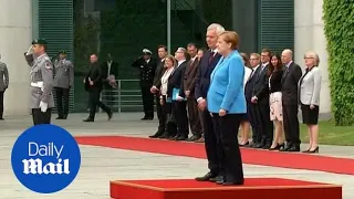 Angela Merkel seen shaking for third time as she greets Finnish PM