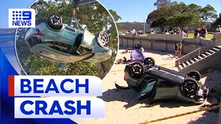 Car crashes and ‘somersaults’ onto Sydney’s Balmoral beach | 9 News Australia