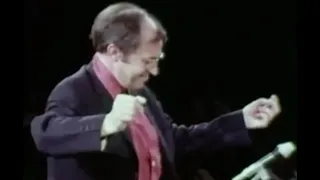 Boulez laughing while conducting