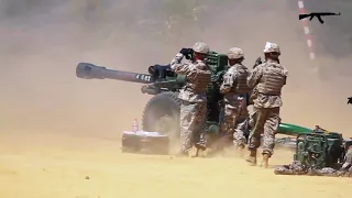 US Army Around Practice Shooting With Guns M777 M109A6