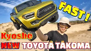 KYOSHO 2021 Toyota Tacoma TRD driving on the beach and jumping. It's pretty fast!