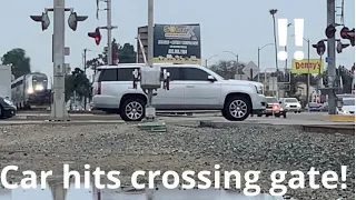 Car goes under the crossing gate and misses train by seconds