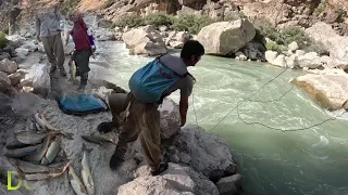 A nomadic man fishing for his family in the scary dangerous mountains