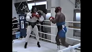 Oliver McCall lands a bomb on Mike Tyson