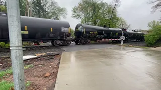 On a rainy day, CSX 3089 tugs a train through Bradley Pkwy, Blauvelt NJ!