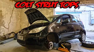 How to change the suspension strut top and bearing on a Mitsubishi Colt