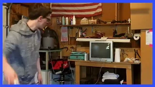 Scott the Woz throwing a wiimote at a TV