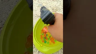 oddly satisfying shoot the soaking balls with the MC 320 toy gun #shorts
