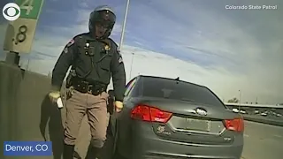 Car just misses hitting Colorado state trooper during traffic stop