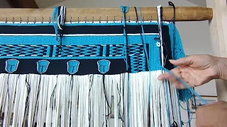 Weaving the side borders with both ravenstail and naaxiin (chilkat) techniques.