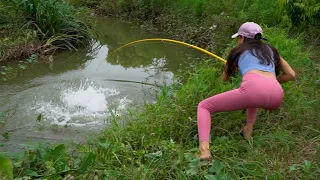 Best Video Hook Fishing. Close-up of Girl Hunting Giant Black Carp with Fishing Hook