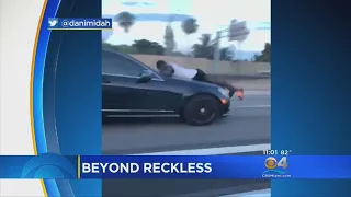 Video Captures Man Riding Hood Of Car On I-95