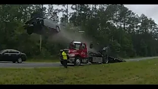 Car launches into the air off a tow truck's ramp in Lowndes County, Georgia