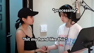 Soyeon helping Shuhua during the recording of 'Nxde'