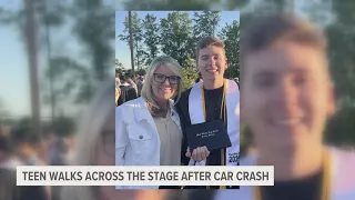 Teen walks across the stage at graduation 2 years after car crash leaves him in critical condition