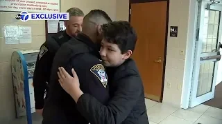 Boy reunited with police officers who rescued him from ice on pond in Livingston