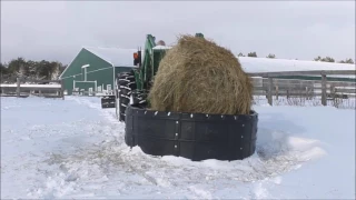 Ultimate Hay Ring - putting a round hay bale in with Tractor