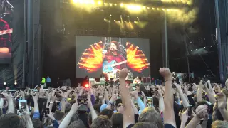 Dave Grohl gets back on stage after breaking leg in Gothenburg, 2015.