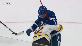 Morgan Rielly retaliates after Tomas Nosek cross-checks Liljegren into the boards