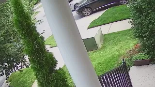 Surveillance video shows Maryland carjacking victim clinging to hood of car | FOX 5 DC