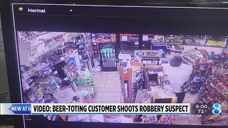 Video: Beer-toting customer shot at robbery suspect 7 times