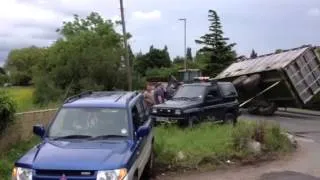 Tractor trailer pulled back over by a Mitsubishi Pinin