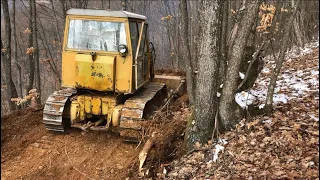 Dozer instaling a new driveway / probijanje puta Tg