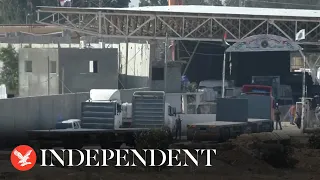 Trucks pass through Rafah border as crossing opens to allow aid into Gaza