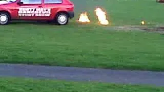 Stunt woman being dragged through fire