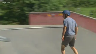 Skateboarding dad wears helmet to promote safety
