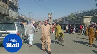 Afghans desperate to flee return to Kabul airport after deadly blasts