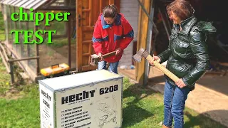 Two girls assembling and testing the Hecht wood chipper