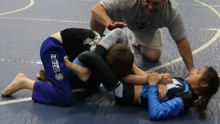 girl vs boy bjj 2023 - evangelene submission by triangle and kimura