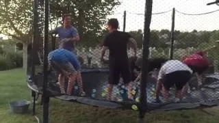 Awesome slo-mo trampoline water balloon fight!