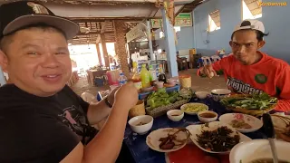 Eating lunch with our Hyundai driver at the restaurant in Laos