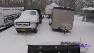 Bobcat T590 plowing snow