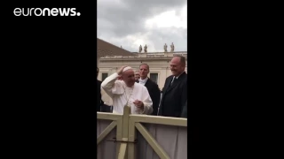 Little girl snatches Pope's skullcap off his head