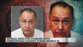 Albuquerque school director charged with threatening student turns himself in