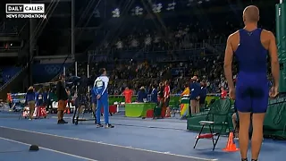 CHILLS: Pole Vaulter Stops For National Anthem