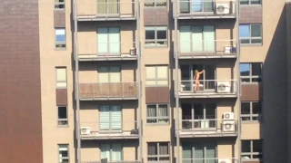 Naked onthe balcony in Warsaw Poland