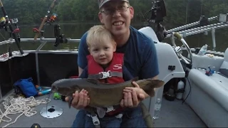 2 yr-old catches his first catfish and loves it. Tommy's first catfish