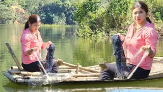 Casting a net on the lake to catch fish, catching a big fish to sell for extra income. Girl's life.