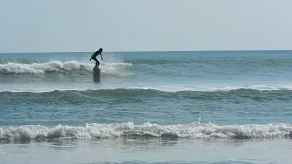 Surfing the Inlet at New Smyrna Beach