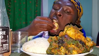 Asmr mukbang spinach soup with pounded yam fufu in Kenya.