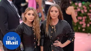 The Olsen twins in black leather dresses for the 2019 Met Gala