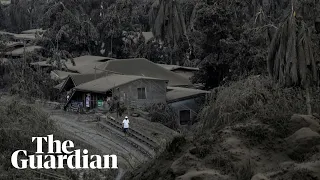 Taal volcano: thousands flee as ash and lightning spurt into sky