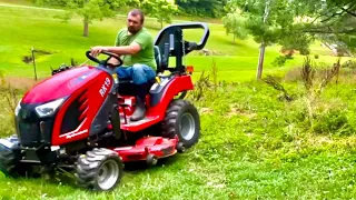 Mowing an overgrown garden with my Rural King RK19 4wd tractor!