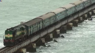 Train crossing Pamban bridge on a windy day.