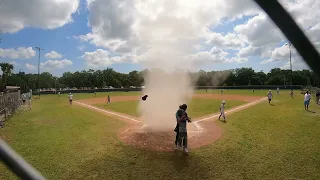 Umpire Saves Little League Player Caught in Dust Devil